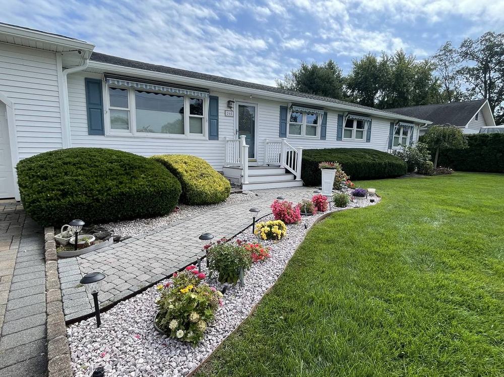 Paver walkway and flower beds