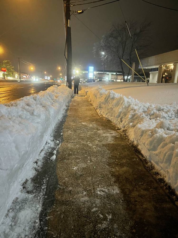 Sidewalk snow removal after a storm